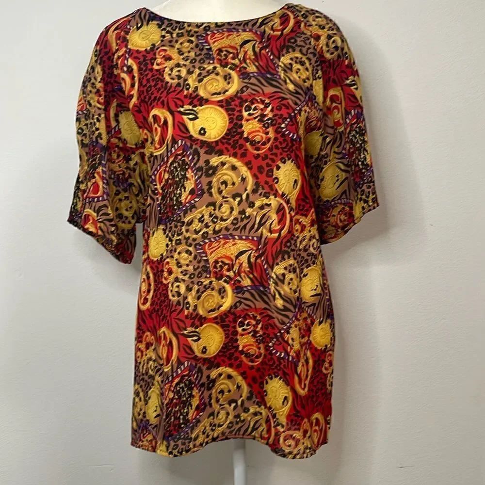 Truffles Woman short sleeve blouse. Sun and leopard print. Size 2X.